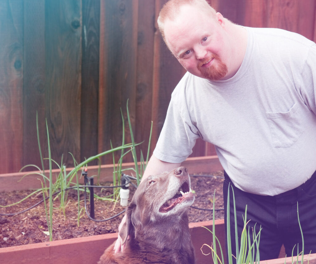 Mann streichelt Hund